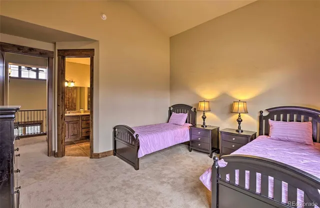 a bedroom with two beds and painted walls