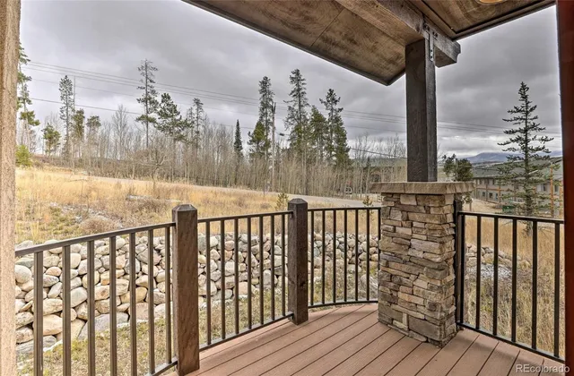 a view of a balcony with wooden floor