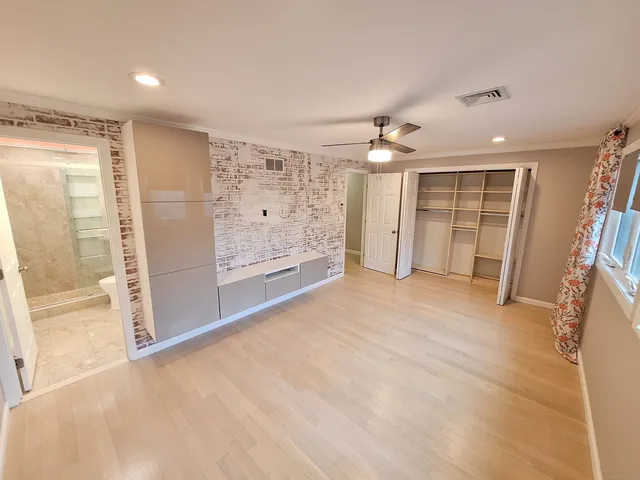 a view of an empty room with a window