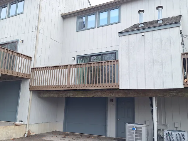a view of a balcony with furniture