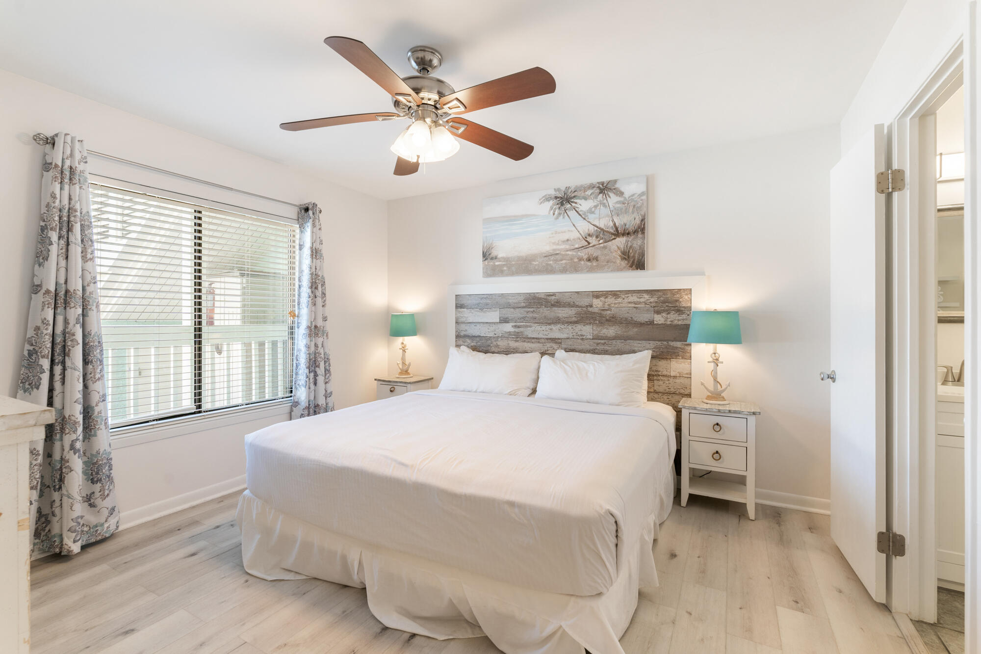 19504 Front Beach Road, Unit 1006 Panama City Beach, FL 32413 - Photo 18 of 34 a bedroom with a large bed and a window