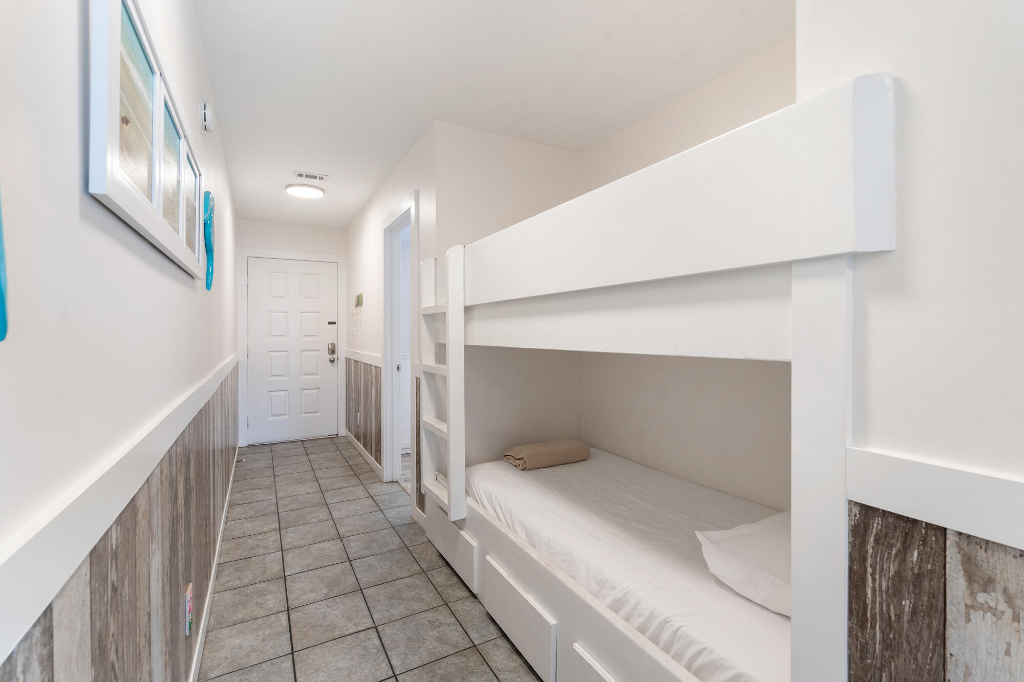 19504 Front Beach Road, Unit 1006 Panama City Beach, FL 32413 - Photo 23 of 34 a bathroom with a sink and a mirror