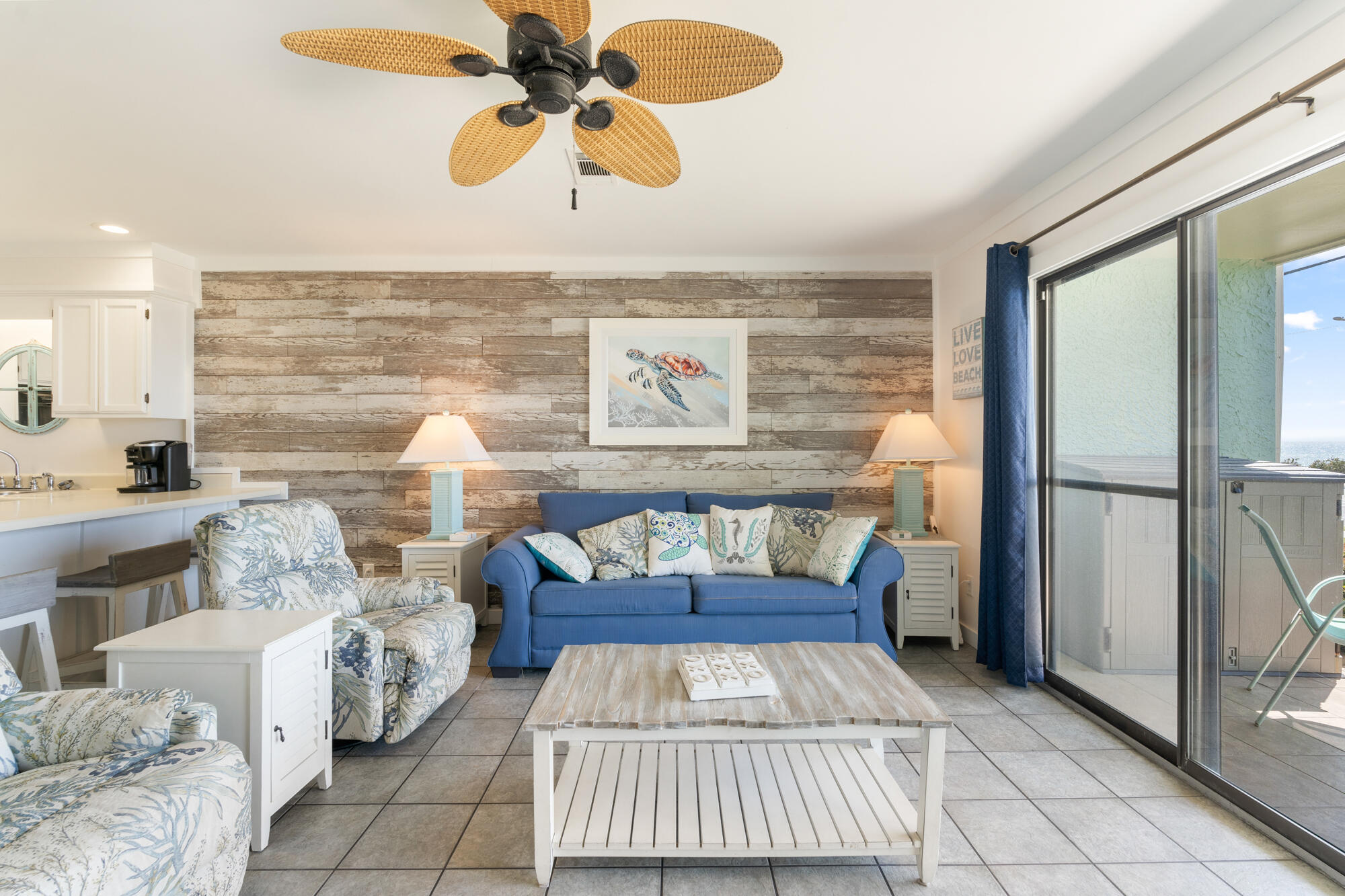 19504 Front Beach Road, Unit 1006 Panama City Beach, FL 32413 - Photo 8 of 34 a living room with furniture and a floor to ceiling window