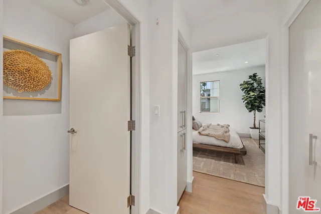 a view of a bedroom from a hallway