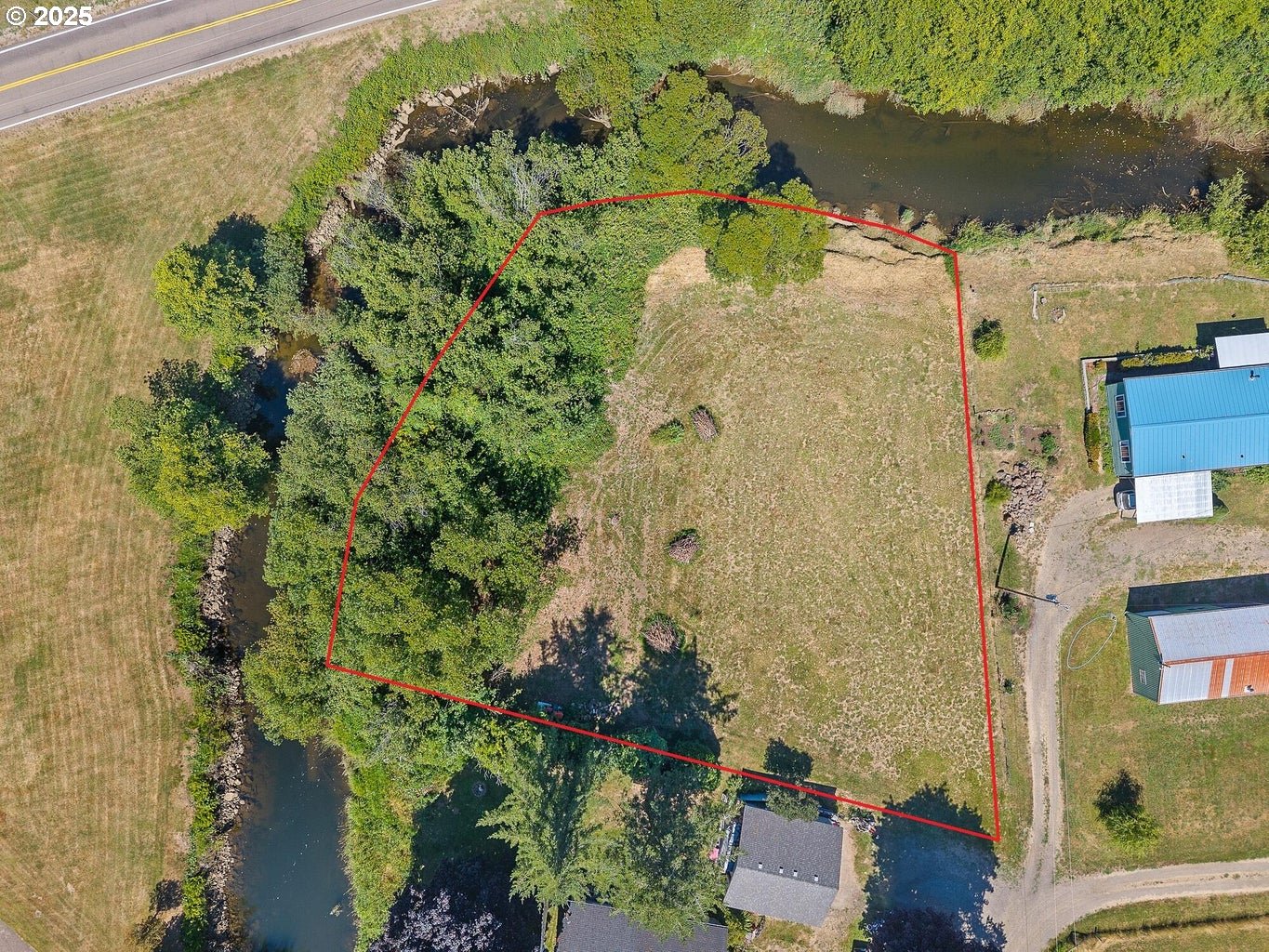 an aerial view of a house with a yard