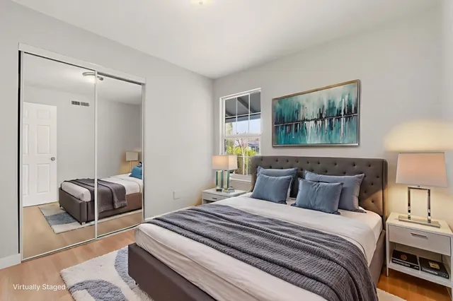 an empty room with windows and closet