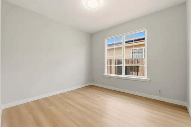 a view of a backyard with table and chairs