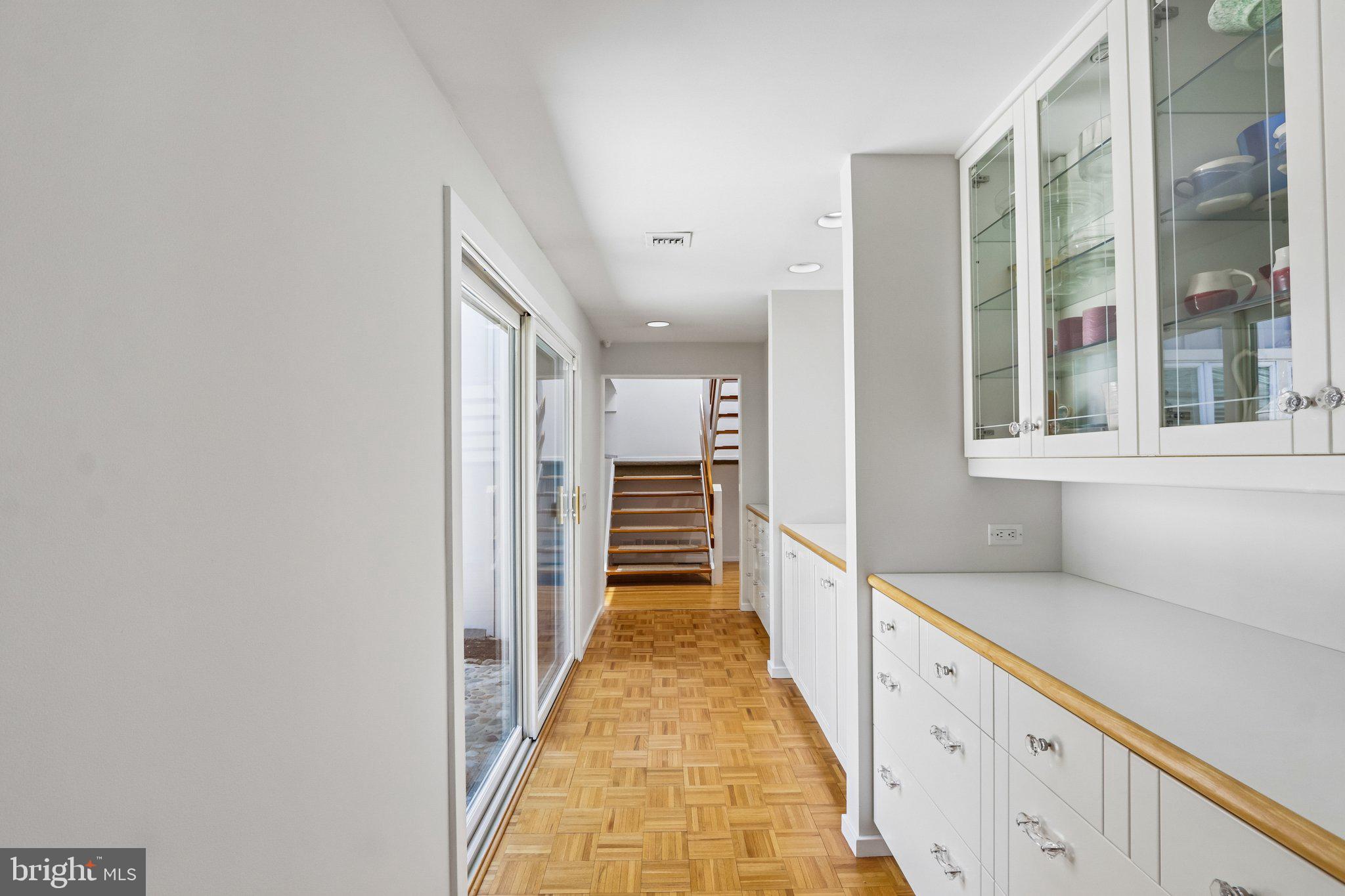 1673 Paper Mill Road Jenkintown, PA 19046 - Photo 16 of 73 a view of a hallway with wooden floor and staircase