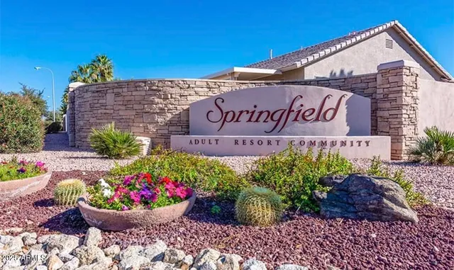 a sign that is in front of flowers