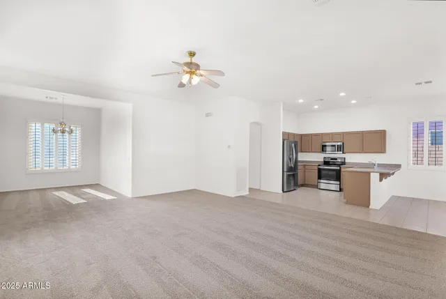 a view of kitchen with microwave and cabinets