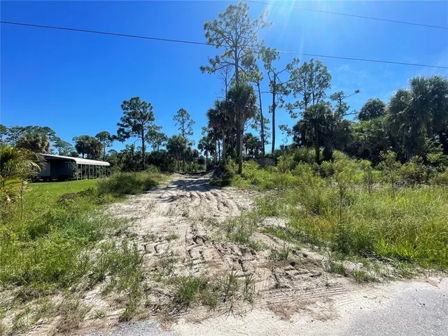 an aerial view of a houses with outdoor space and lake view