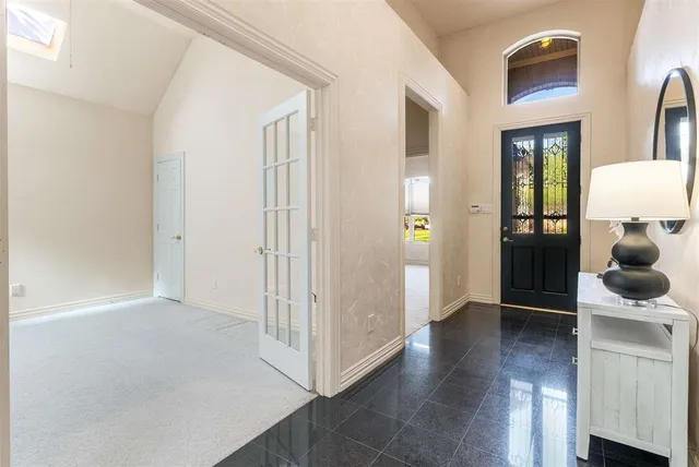 a view of hallway with wooden floor