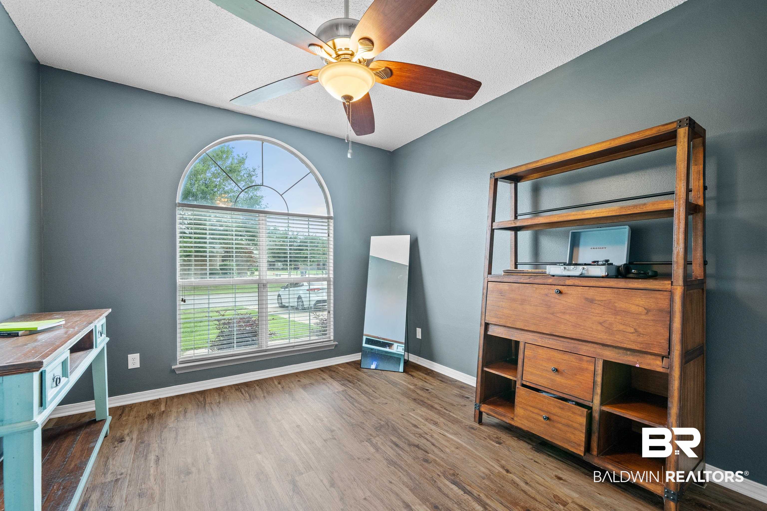 9552 Collier Loop Daphne, AL 36526 - Photo 4 of 28 Unfurnished office featuring small closet, ceiling fan, a textured ceiling, baseboards and wood finished floors