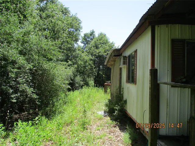 a backyard of a house with lots of green space