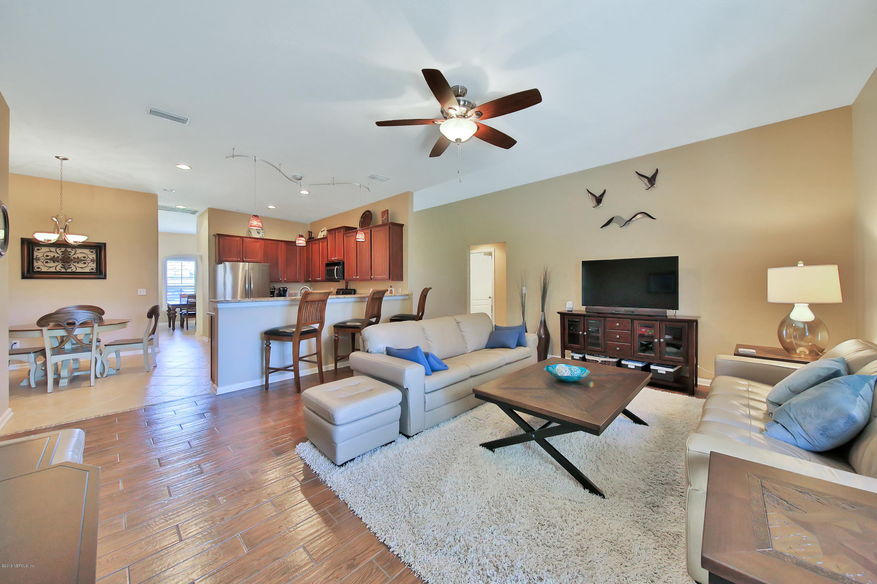 712 Porta Rosa Circle St. Augustine, FL 32092 - Photo 12 of 34 a living room with furniture and a flat screen tv