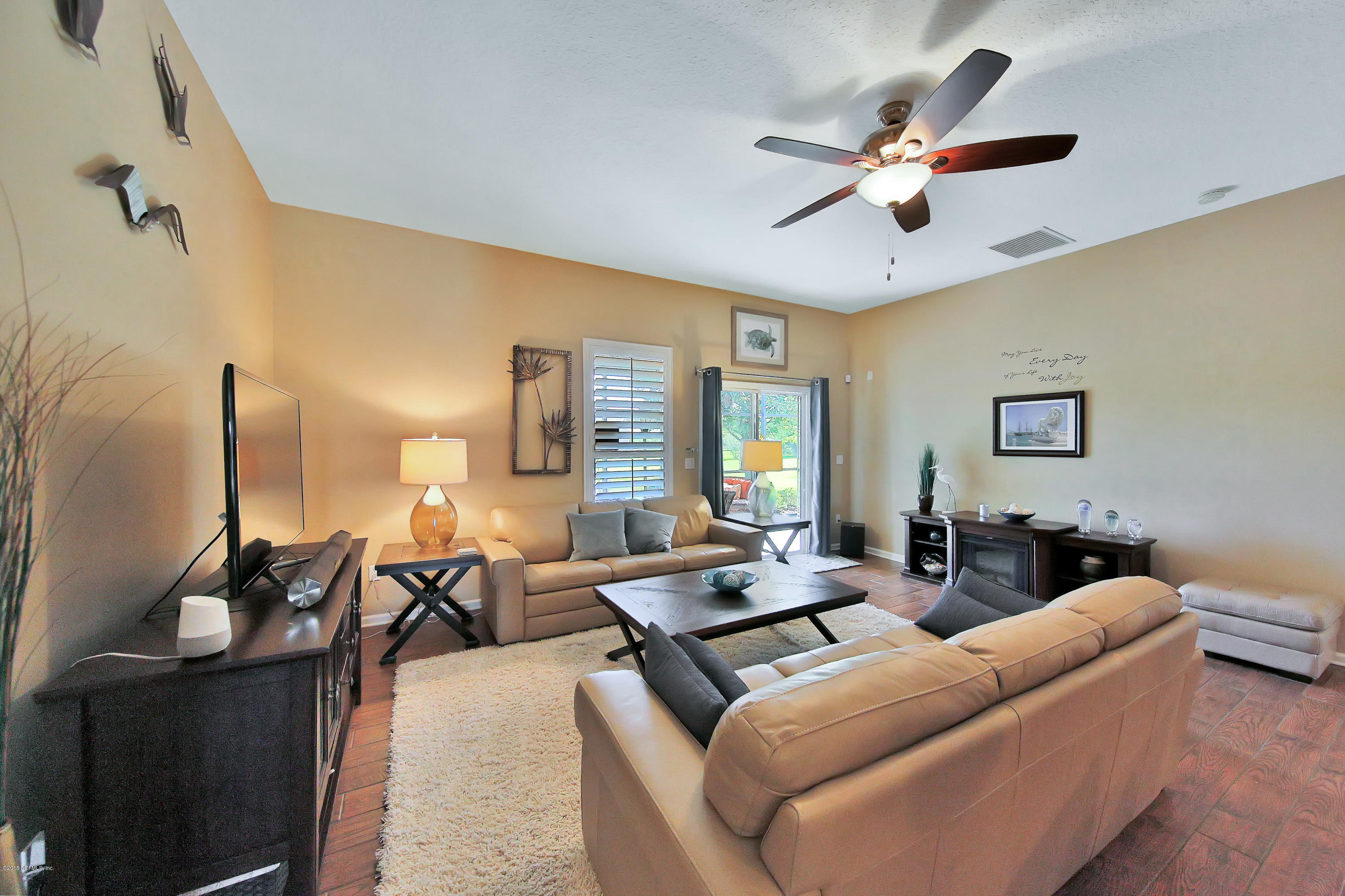 712 Porta Rosa Circle St. Augustine, FL 32092 - Photo 13 of 34 a living room with furniture ceiling fan and a rug