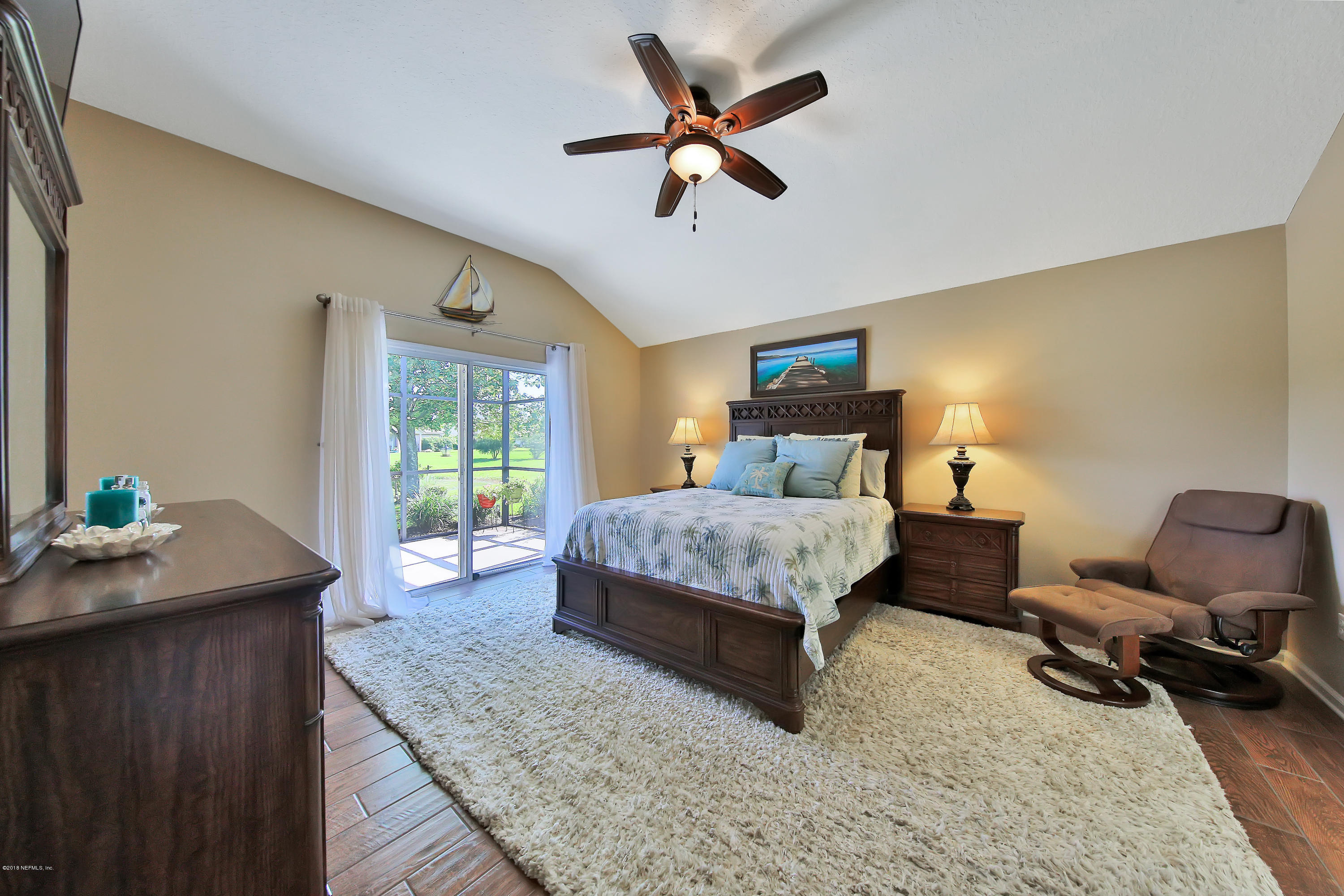 712 Porta Rosa Circle St. Augustine, FL 32092 - Photo 14 of 34 a bedroom with a bed window and a desk