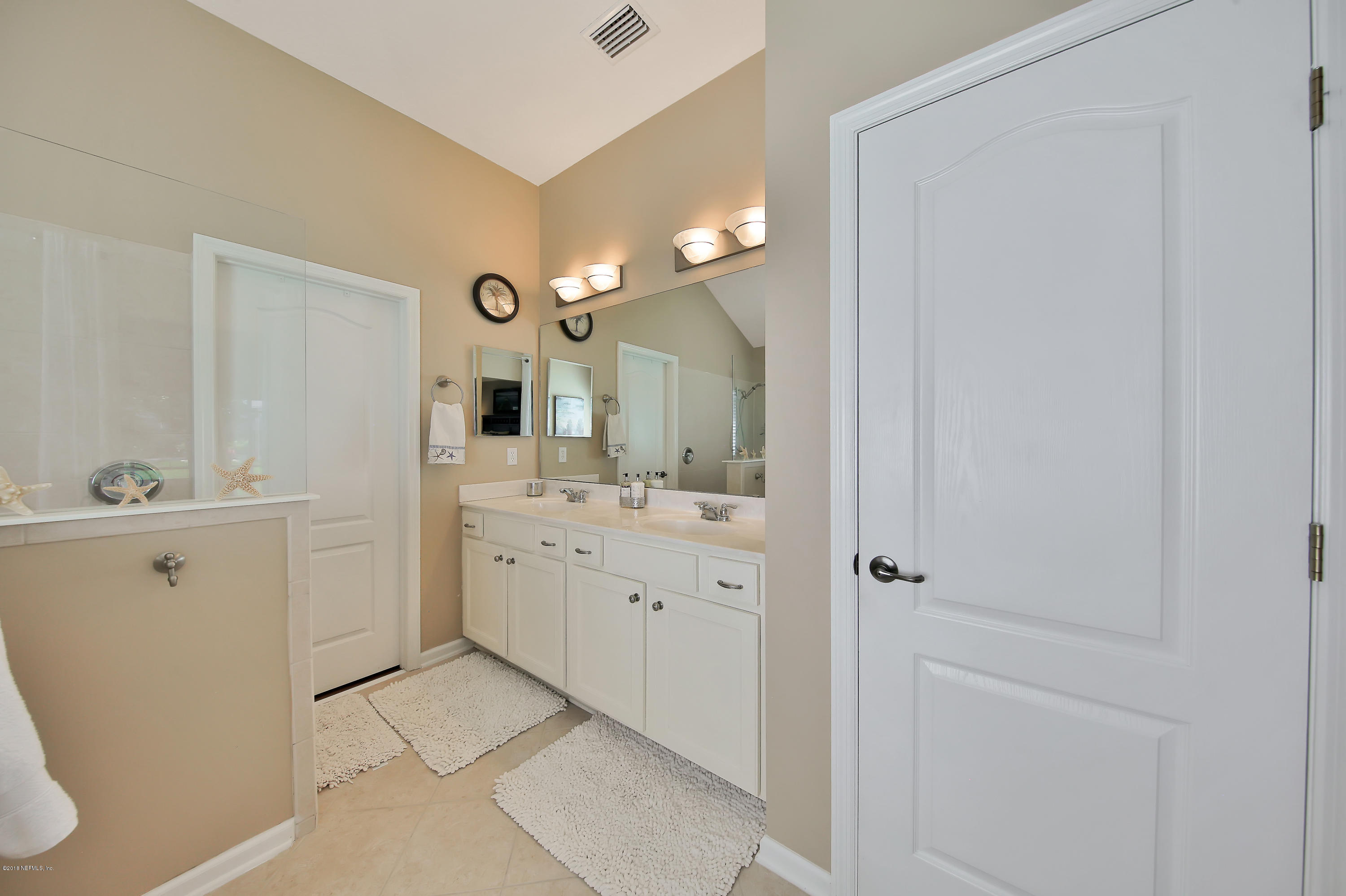 712 Porta Rosa Circle St. Augustine, FL 32092 - Photo 16 of 34 a spacious bathroom with a double vanity sink mirror and
