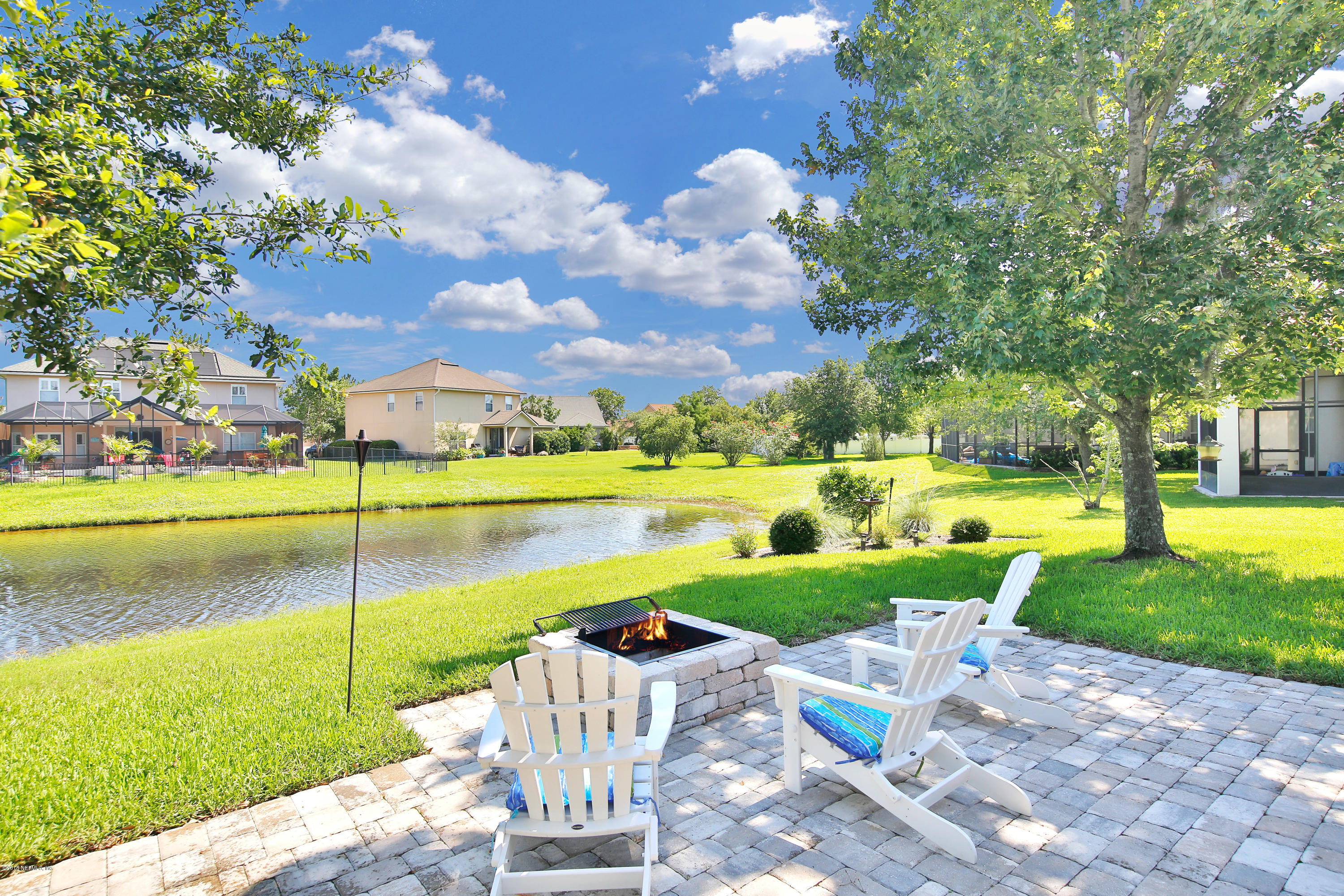 712 Porta Rosa Circle St. Augustine, FL 32092 - Photo 20 of 34 a view of a garden and swimming pool