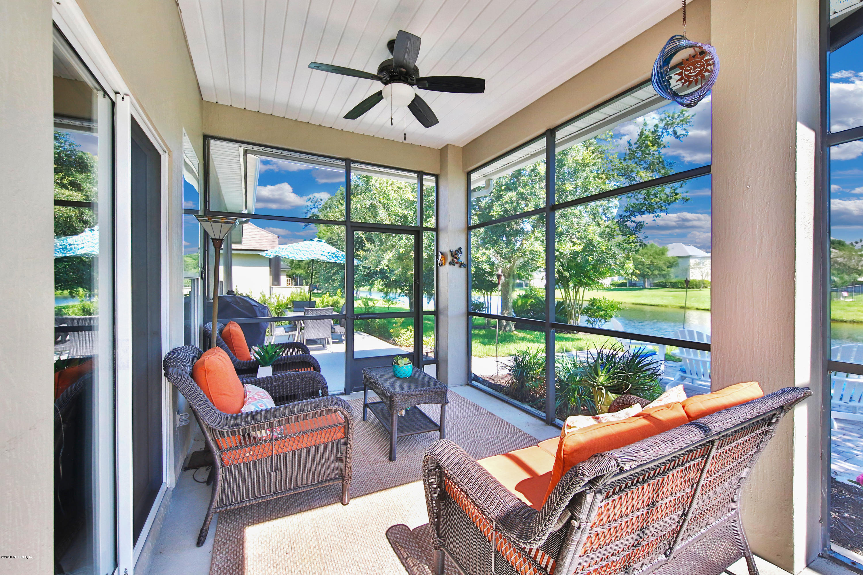 712 Porta Rosa Circle St. Augustine, FL 32092 - Photo 22 of 34 a outdoor space with couch and a ceiling fan