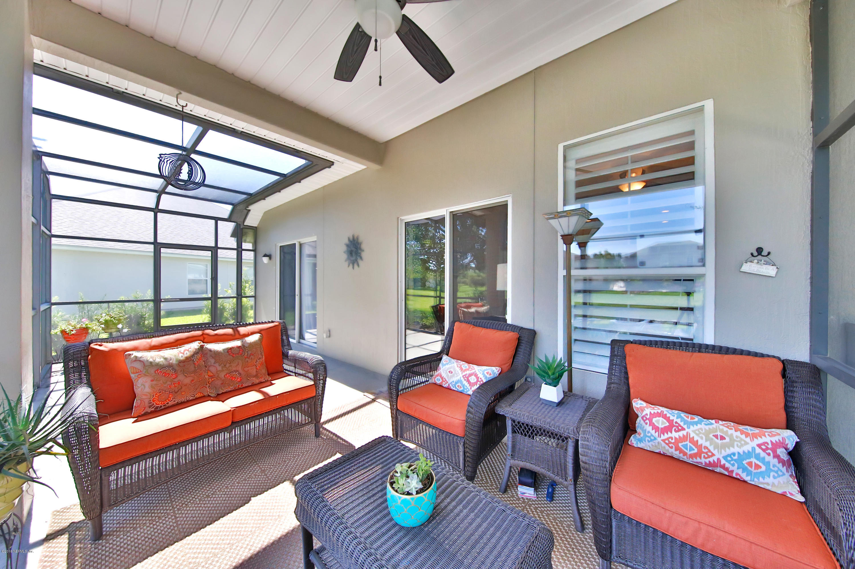712 Porta Rosa Circle St. Augustine, FL 32092 - Photo 23 of 34 a living room with furniture and a window