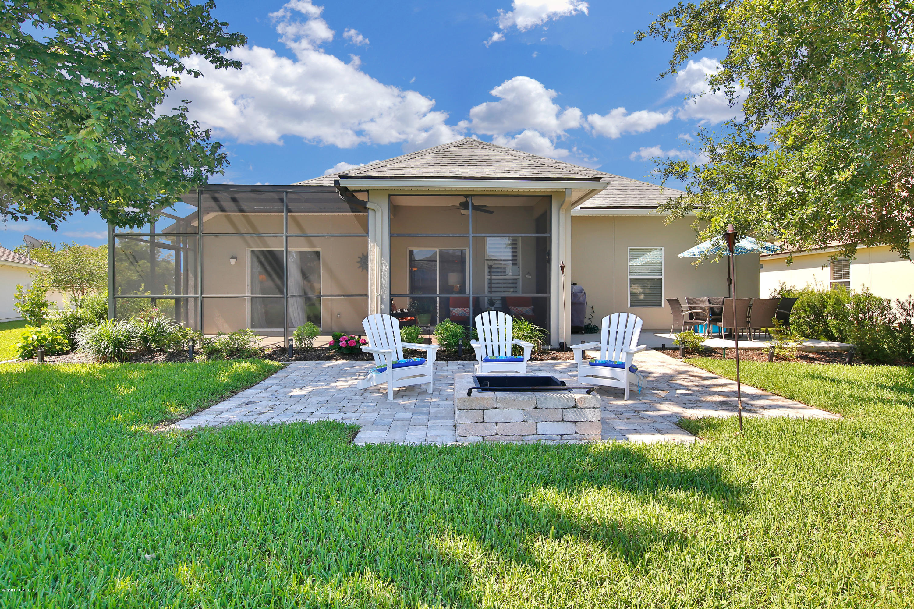 712 Porta Rosa Circle St. Augustine, FL 32092 - Photo 26 of 34 a view of a house with backyard sitting area and garden