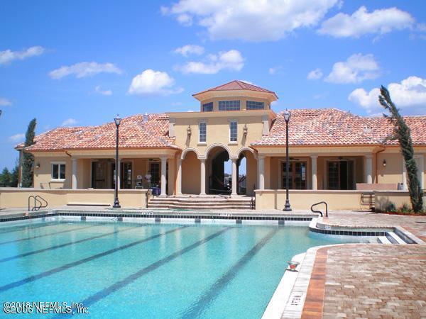 712 Porta Rosa Circle St. Augustine, FL 32092 - Photo 29 of 34 a view of a patio with dining table and chairs with a barbeque grill and a yard