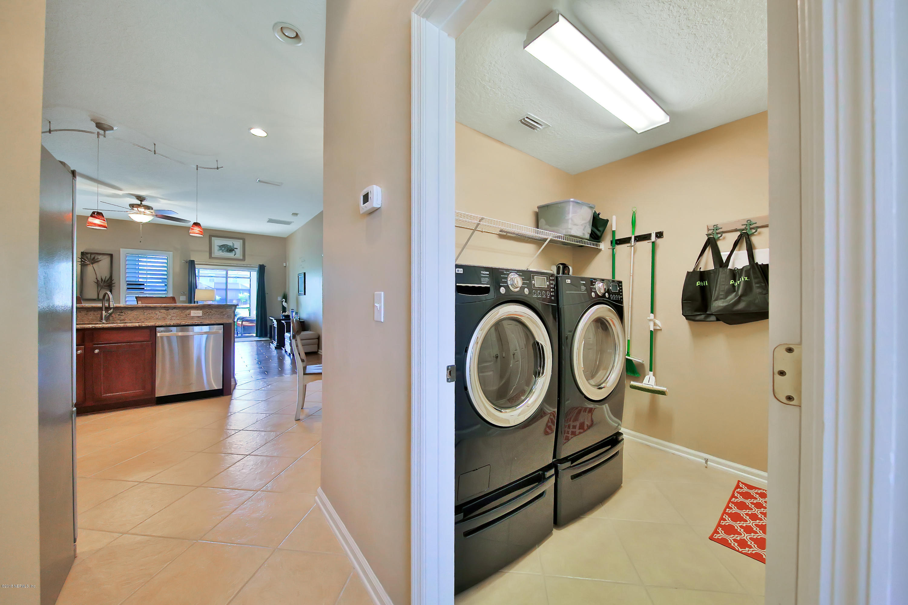 712 Porta Rosa Circle St. Augustine, FL 32092 - Photo 7 of 34 a view of a hallway with washer and dryer