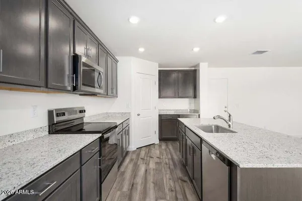 a bathroom with a double vanity sink mirror and shower