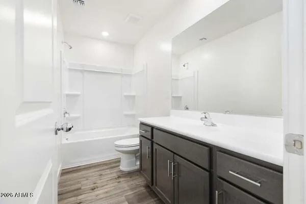 a kitchen with stainless steel appliances granite countertop a sink and a stove