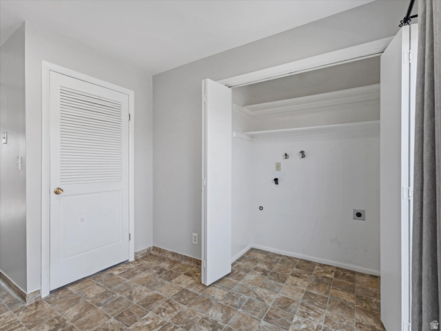 1478 North 75 West, Unit AD Sunset, UT 84015 - Photo 21 of 26 Laundry area featuring stone finish flooring, washer hookup, and electric dryer hookup