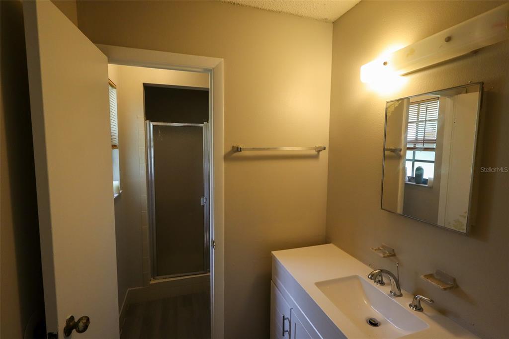 66 Silver Lane Ocala, FL 34472 - Photo 9 of 10 a bathroom with a sink and mirror with toilet