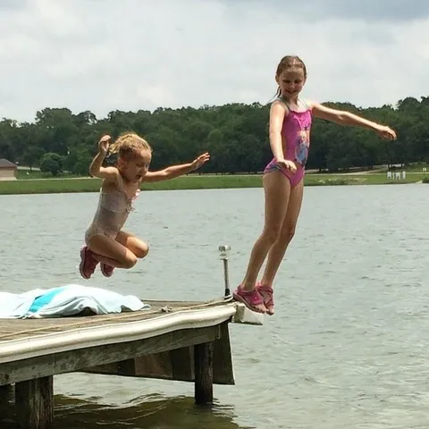 a view of a car with car parked on the side of the road