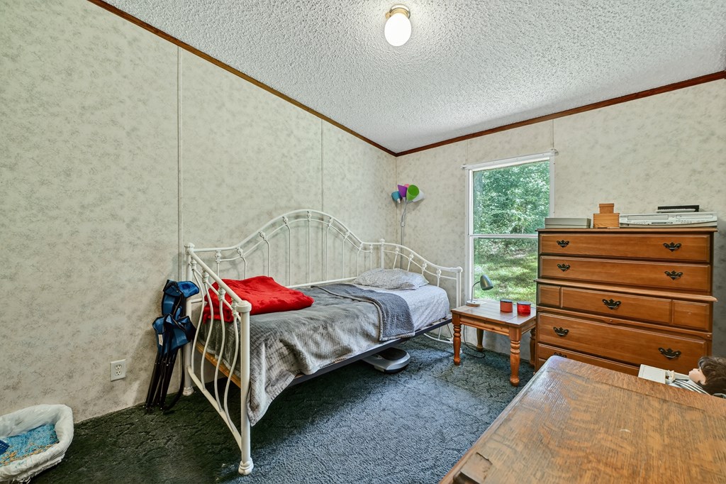 354 Circle Drive Blue Ridge, GA 30513 - Photo 26 of 41 a bedroom with a bed and a window