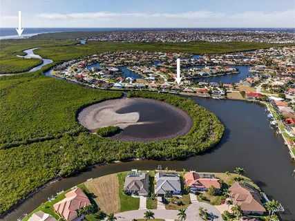 an aerial view of a house with outdoor space