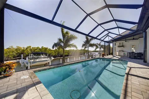 a view of a swimming pool with a patio