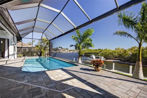 a view of a swimming pool with a patio