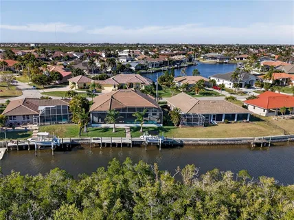 an aerial view of a house with a lake view