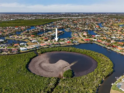 an aerial view of a city and ocean view