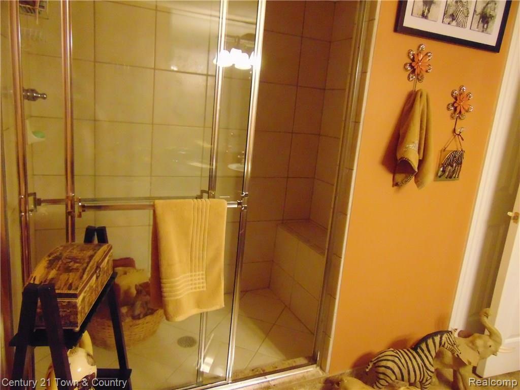 4731 Oakhurst Ridge Road Clarkston, MI 48348 - Photo 46 of 59 FLOOR TO CEILING CERAMIC TILE IN THE LOWER LEVEL SHOWER.....