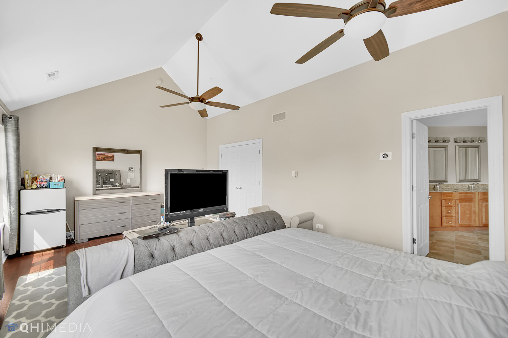 Undisclosed Address Steger, IL 60475 - Photo 12 of 29 a bedroom with a bed and a flat screen tv