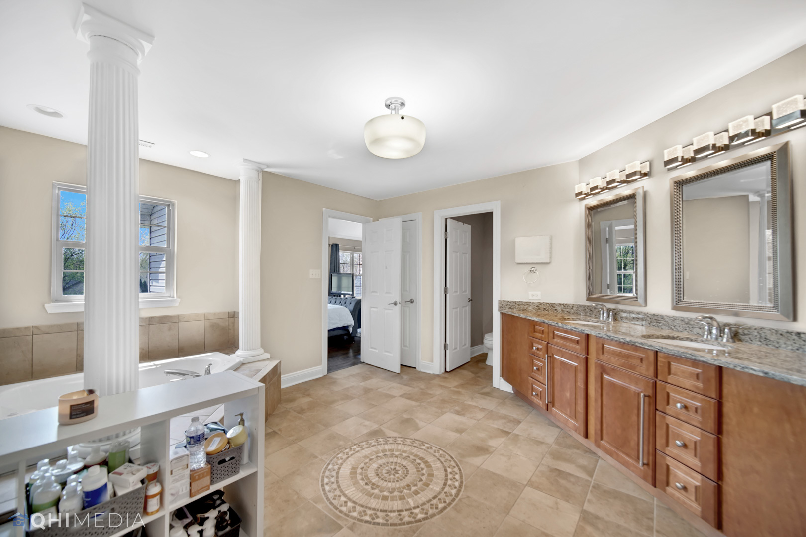 Undisclosed Address Steger, IL 60475 - Photo 13 of 29 a large bathroom with a granite countertop double vanity sink a mirror and a bathtub