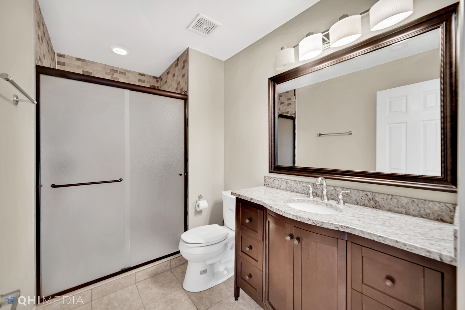 Undisclosed Address Steger, IL 60475 - Photo 17 of 29 a bathroom with a granite countertop sink mirror vanity and toilet