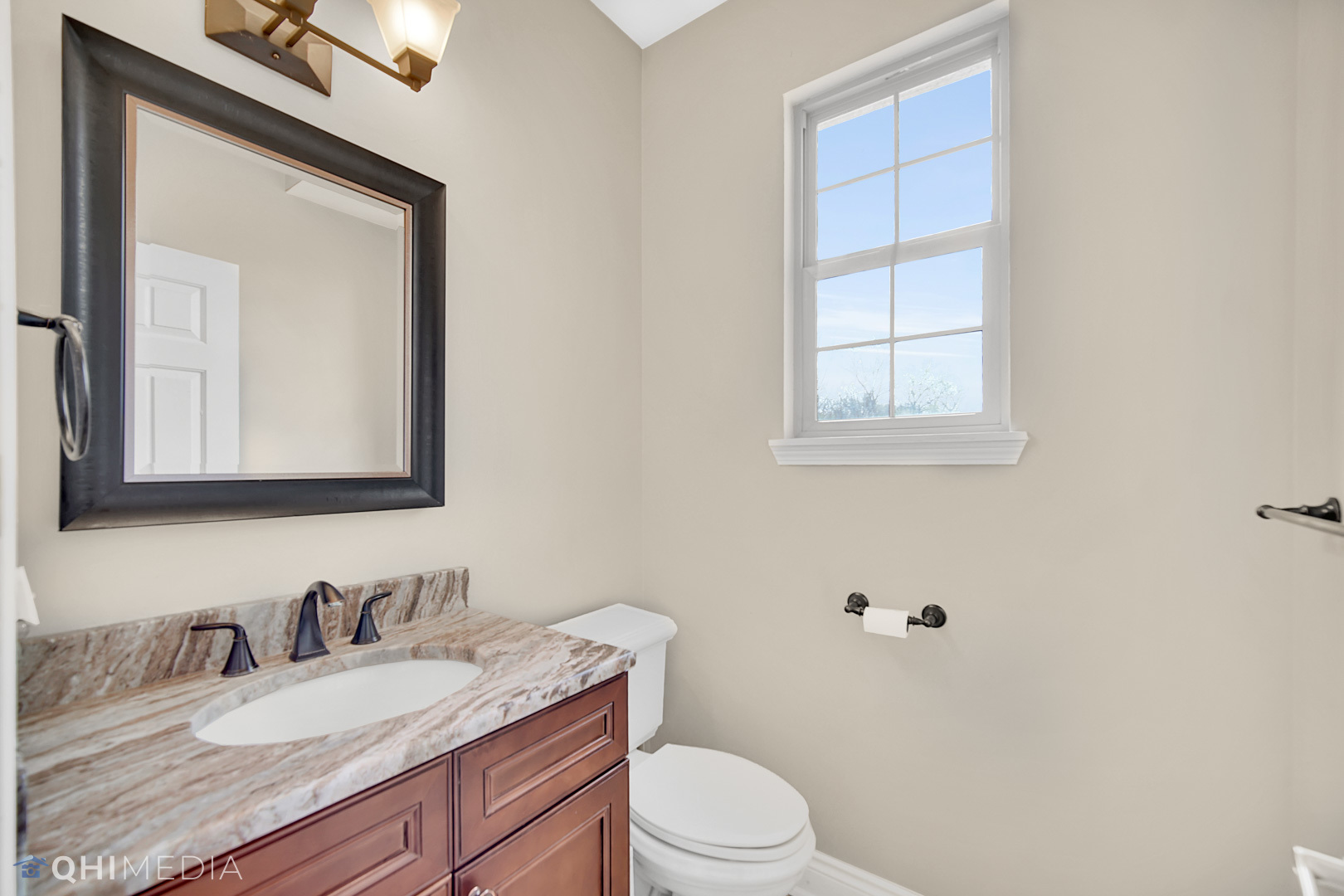 Undisclosed Address Steger, IL 60475 - Photo 19 of 29 a bathroom with a granite countertop toilet sink and mirror