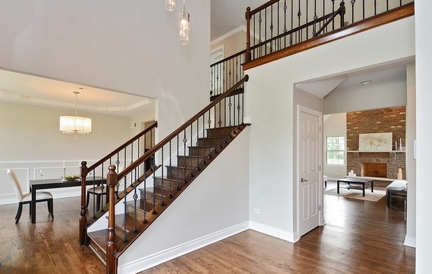 Undisclosed Address Steger, IL 60475 - Photo 3 of 29 a view of staircase with wooden floor and a chandelier