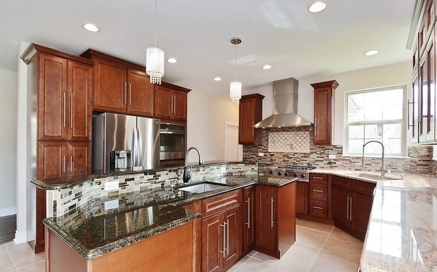 Undisclosed Address Steger, IL 60475 - Photo 6 of 29 a kitchen with kitchen island granite countertop a sink stove and refrigerator