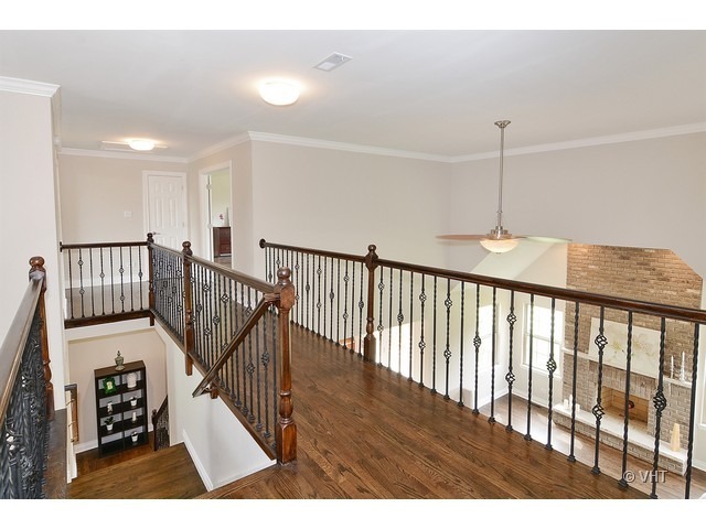 Undisclosed Address Steger, IL 60475 - Photo 10 of 29 a view of a hallway with wooden floor
