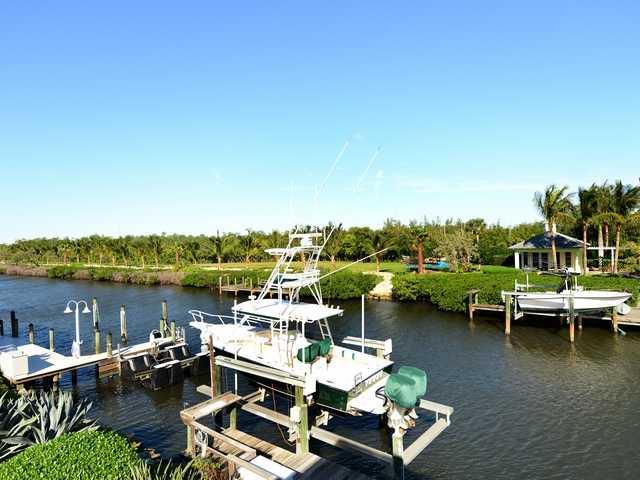 4259 Rigels Cove Way Jensen Beach, FL 34957 - Photo 15 of 22 a view of a lake with boats