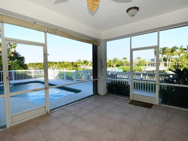 4259 Rigels Cove Way Jensen Beach, FL 34957 - Photo 16 of 22 a view of an empty room with a floor to ceiling window