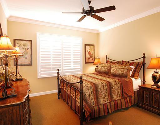 4259 Rigels Cove Way Jensen Beach, FL 34957 - Photo 18 of 22 a bedroom with a bed and a window